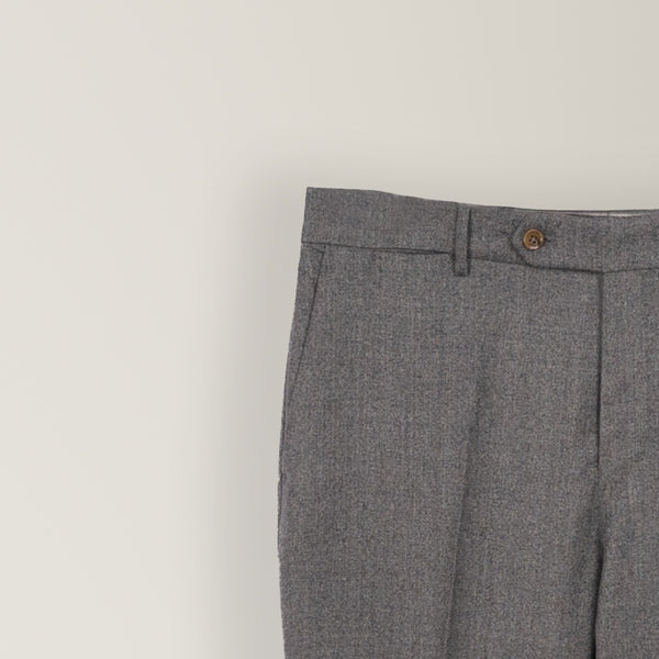 Italian-made mid grey flannel trouser in 100% wool with a flat front and tapered leg.