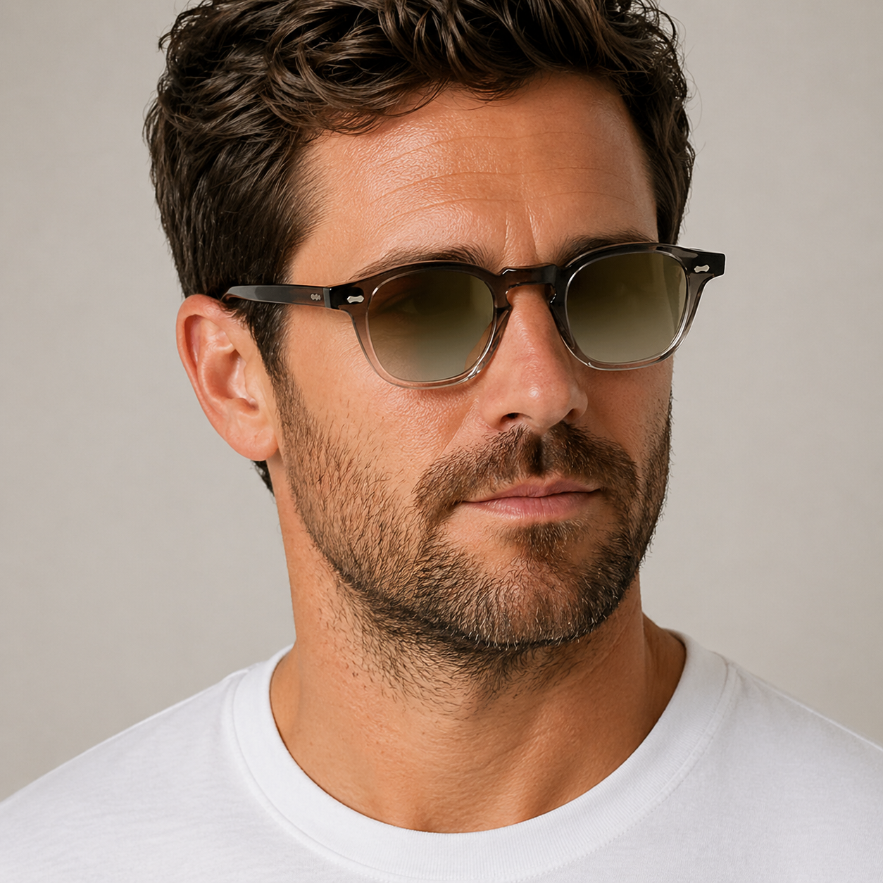 Cord Eco Ash square sunglasses with green mirror lenses worn by male model in his 30s, close-up studio portrait styled with white cotton T-shirt.