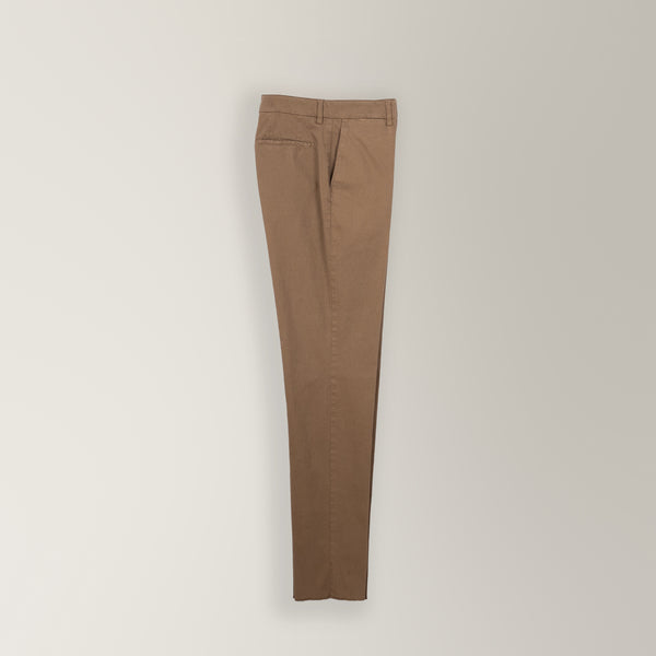 Italian-made light brown garment-dyed cotton chino with tapered leg and unfinished hem.