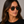 Panama Eco Havana square sunglasses with bottle green lenses worn by female model in her 30s, close-up studio portrait styled with a black T-shirt, highlighting the warm-toned eco-acetate frame and clean, structured silhouette.
